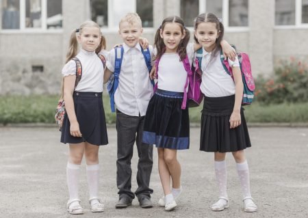 boy-hugging-girls-near-school